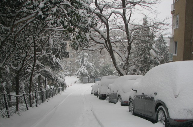 A side street covered in snow.
