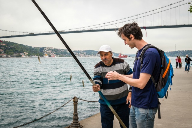 Fisher at Bosphorus Strait in Istanbul, Turkey