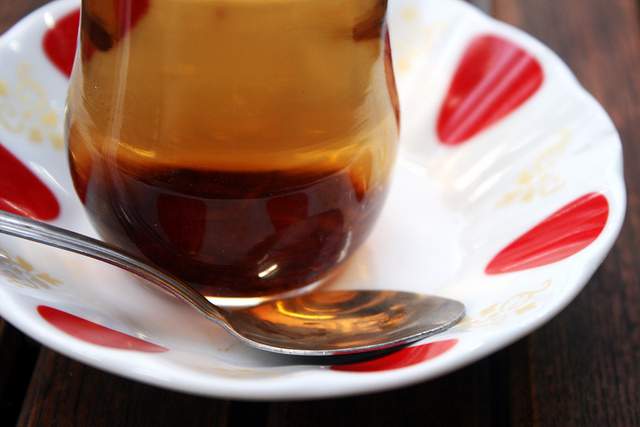 Tulip tea glass and a spoon